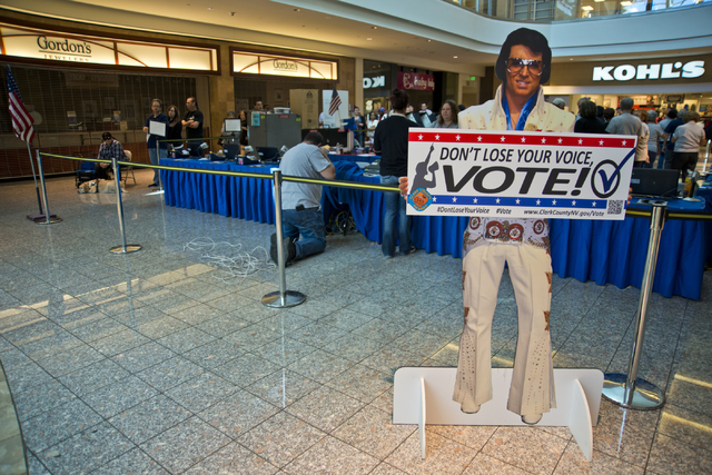 A stand-up Elvis encourages voters to stand in line and be among the first to vote in Nevada at the Galleria at Sunset in Henderson on Saturday morning, Oct. 22, 2016. Daniel Clark/Las Vegas Revie ...
