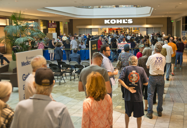 Voters stand in line to be among the first to vote in Nevada during early voting at the Galleria at Sunset in Henderson on Saturday morning, Oct. 22, 2016. Daniel Clark/Las Vegas Review-Journal Fo ...