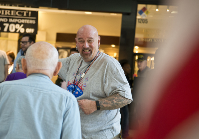 Phillip Hollon directs voters through the check-in process during early voting at the Galleria at Sunset in Henderson on Saturday morning, Oct. 22, 2016. Daniel Clark/Las Vegas Review-Journal Foll ...
