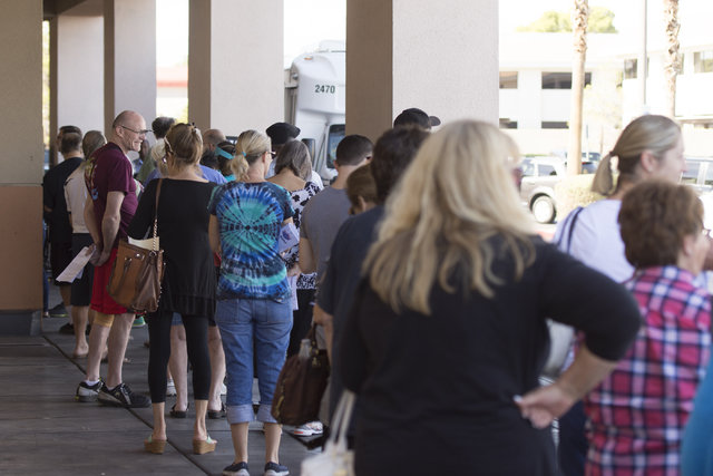 Voters stand in line for early voting at Albertsons at 2885 E. Desert Inn Rd. in Las Vegas, Saturday, Oct. 22, 2016. Jason Ogulnik/Las Vegas Review-Journal