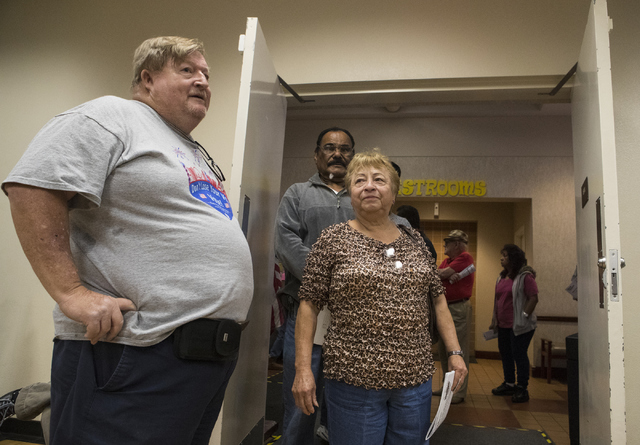 Poll worker Johnny Vaught helps assists voters during early voting at the East Las Vegas Community Center in Las Vegas on Saturday, Oct. 22, 2016. Loren Townsley/Las Vegas Review-Journal Follow @l ...