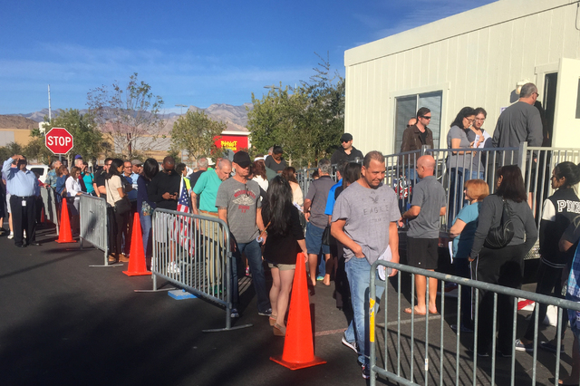 Early voters wait in line Saturday for the 9 a.m. start in a parking lot at Downtown Summerlin on Saturday Oct. 22, 2016. (Keith Rogers/Las Vegas Review-Journal)