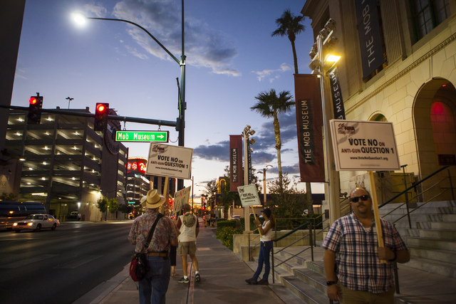 People rally outside of the Mob Museum ahead of a town hall discussion on Question 1 in Las Vegas on Thursday, Sept. 29, 2016. Question 1 is the Nevada State ballot initiative to expand firearm ba ...
