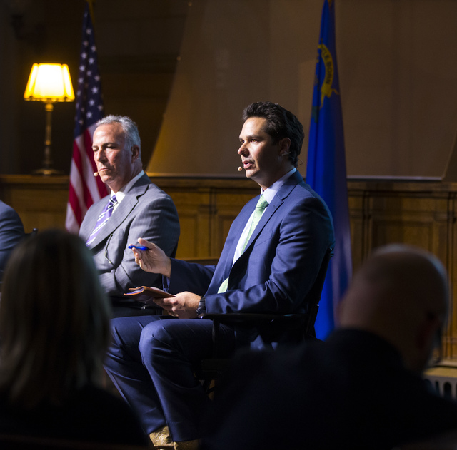 National Rifle Association state legislative liaison Dan Reid, right, speaks during a town hall discussion on Question 1 at the Mob Museum in Las Vegas on Thursday, Sept. 29, 2016. Question 1 is t ...