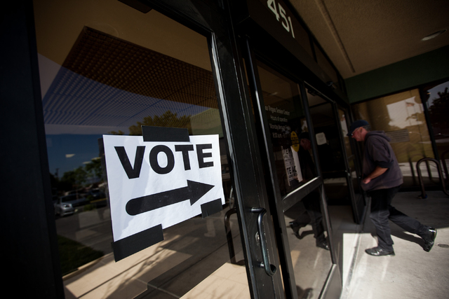 A sign directing people to the municipal election polling place inside the Las Vegas Senior Center is seen at 451 E. Bonanza Road in Las Vegas on Tuesday, April 7, 2015. (Chase Stevens/Las Vegas R ...