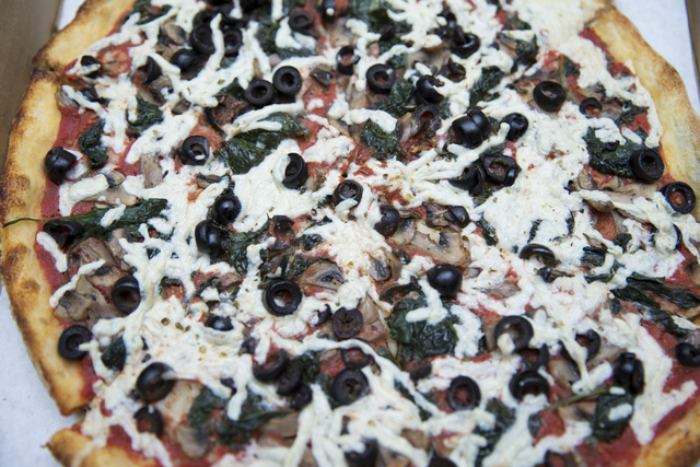 The vegan pizza with Daiya cheese, mushrooms and spinach is seen at Pizza Company, 2275 E. Sunset Road. Erik Verduzco/View
