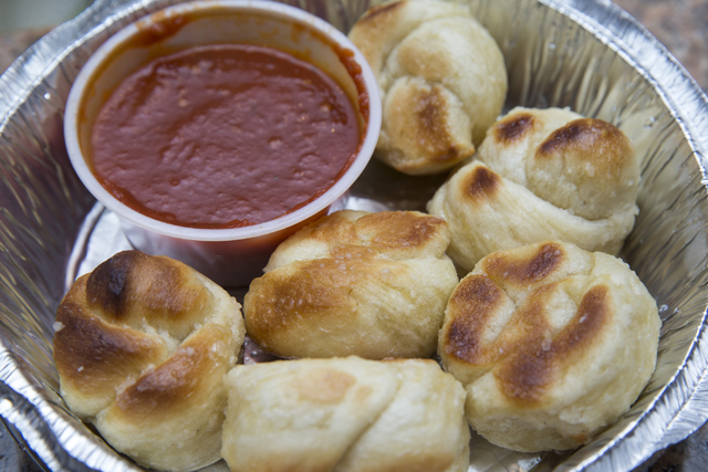 Vegan garlic knots with marinara sauce are seen at Pizza Company, 2275 E. Sunset Road. Erik Verduzco/View
