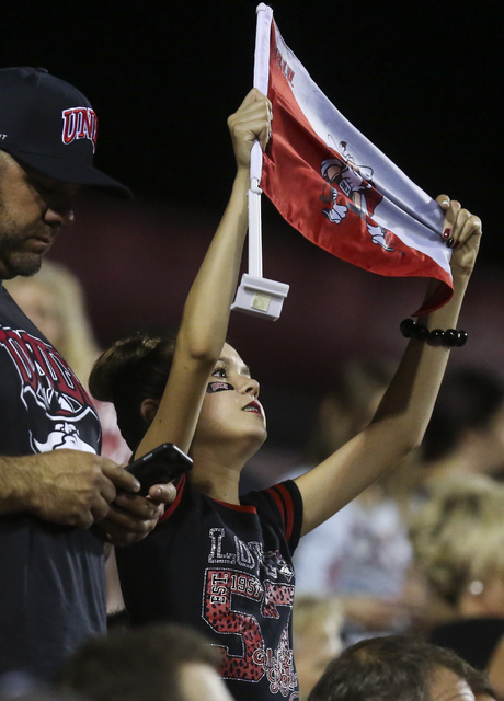 A young UNLV fan raises a Rebels flag during a football game against Fresno State at Sam Boyd Stadium in Las Vegas on Saturday, Oct. 1, 2016. Miranda Alam/Las Vegas Review-Journal Follow @miranda_alam