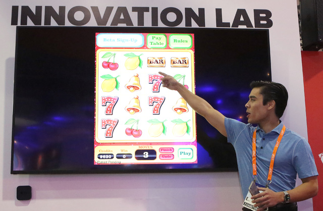 Troy Pettie, UNLV student and Guru Games founder, demonstrates Line em Up game he invented  with Troy Pettie during Global Gaming Expo Tuesday, Sept. 27, 2016, at the Sands Expo and Convention Cen ...