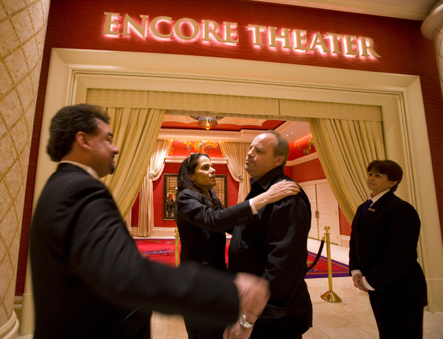 Encore Theater ushers, Max Marquez, left to right,  Ned Rohani and Karen Swigart hug Chip Lightman, manager for Danny Gans, at the Encore hotel-casnio on Friday, May 1, 2009. The Las Vegas impress ...