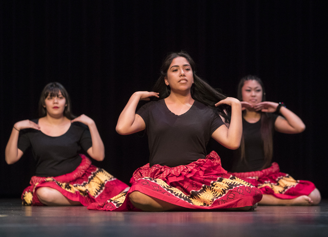 Deborah Pacheco, from left, Priscilla Lopez and Abbigail Harbinger perform a traditional Polynesian dance during the Clark County School District's announcement of graduation rates on Thursday, Oc ...