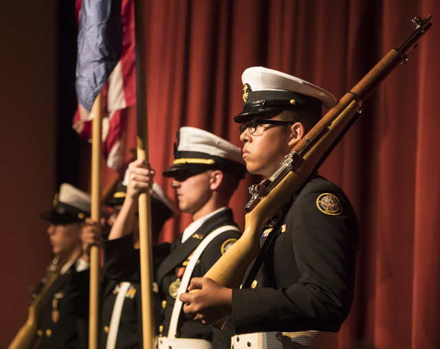 ROTC students including Jesus Quintana, right, and Michael Brown perform during the Clark County School District's announcement of graduation rates on Thursday, Oct. 13, 2016, at Chaparral High Sc ...