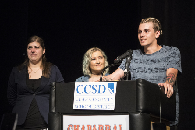 Andrew Solis speaks during the Clark County School District's announcement of graduation rates on Thursday, Oct. 13, 2016, at Chaparral High School in Las Vegas, while Katy Wilcox and Robyn Markar ...