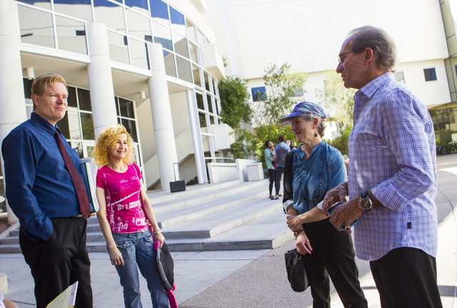 Jean Sternlight, director of the Saltman Center for Conflict Resolution, third from left, with Michael Saltman, far right, talk with people outside of the William S. Boyd School of Law at UNLV in ...