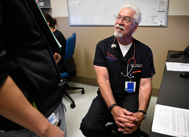 University Medical Center Chief of Staff Dr. Dale Carrison is consulted by a resident doctor in a dictation room at the hospital Monday, Oct. 24, 2016, in Las Vegas. Carrison, a 26-year veteran at ...