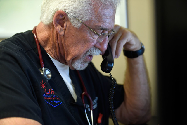 University Medical Center Chief of Staff Dr. Dale Carrison dictates notes after tending to a patient in the emergency department at the hospital Monday, Oct. 24, 2016, in Las Vegas. Carrison, a 26 ...