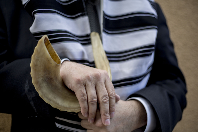 Rabbi Mendy Harlig of Chabad of Green Valley, whose synagogue is offering free seating to services during High Holy Days, holds a rams horn, Thursday, Sept. 29, 2016, in Henderson. Elizabeth Page  ...