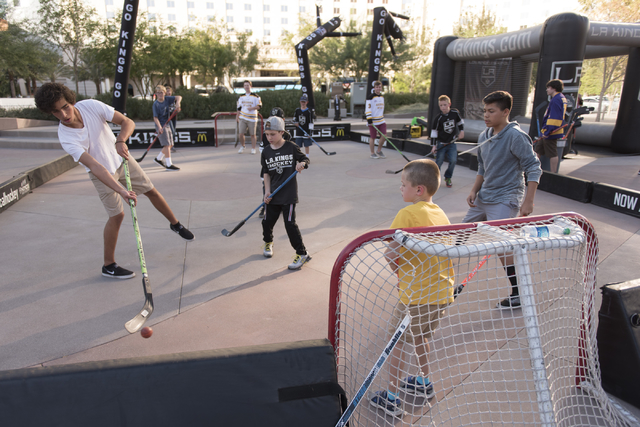 Children play a game of street hockey during the Vegas Hockey Fan Fest at Toshiba Plaza in Las Vegas, Saturday, Oct. 8, 2016. Jason Ogulnik/Las Vegas Review-Journal