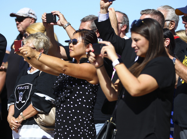 People take photos during the groundbreaking ceremony for the Las Vegas NHL expansion team's practice facility and headquarters in Las Vegas on Wednesday, Oct. 5, 2016. (Chase Stevens/Las Vegas Re ...