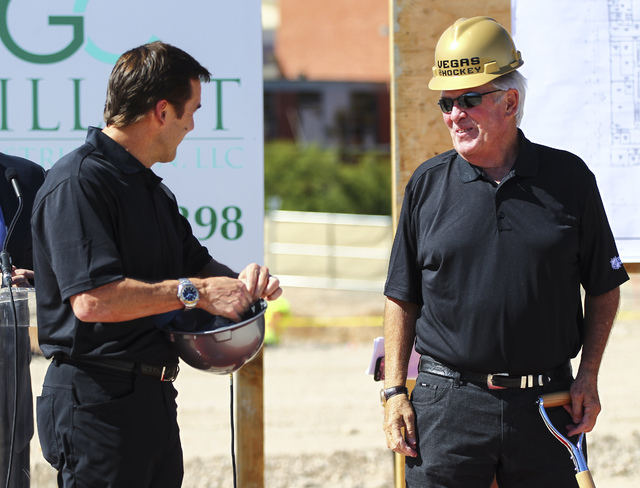 Bill Foley, the owner of Las Vegas' NHL expansion team,  right, talks with George McPhee, general manager of the team, during the groundbreaking ceremony for the team's practice facility and headq ...