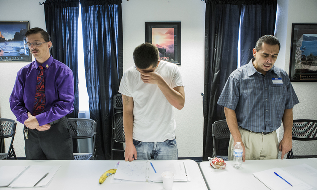 Aaron Vela, center, cries while Steven Wiegand, left, and Edward Vargas stand during a pre-vocational leadership workshop on Thursday, Aug. 18, 2016. (Jeff Scheid/Las Vegas Review-Journal) Follow ...