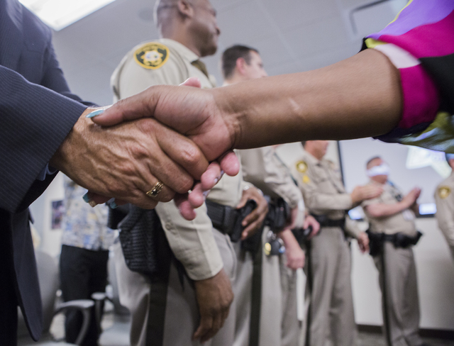 Jannie James shakes hands after a Hope for Prisoners graduation at Metropolitan Police Department headquarters, 400 S. Martin Luther King Blvd., on Friday, Aug. 19, 2016. (Jeff Scheid/Las Vegas Re ...