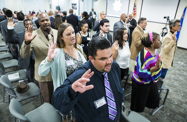 Hope for Prisoners clients take an oath during a graduation at Metropolitan Police Department headquarters, 400 S. Martin Luther King Blvd., on Friday, Aug. 19, 2016. (Jeff Scheid/Las Vegas Review ...