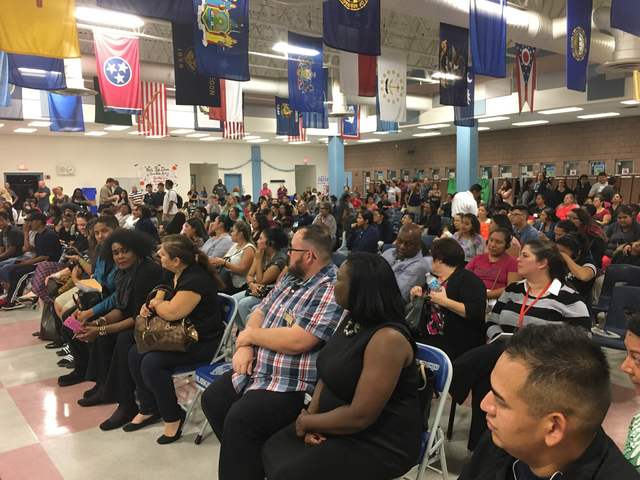 Parents and staff members attend a meeting in the cafeteria at West Preparatory Institute for Academic Excellence in Las Vegas on Tuesday, Oct. 18, 2016, to discuss about the possibility of a char ...