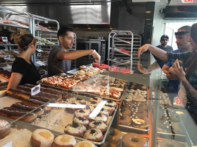 Customers order doughnuts at Donut Bar, 124 S. Sixth St. Sandy Lopez/View