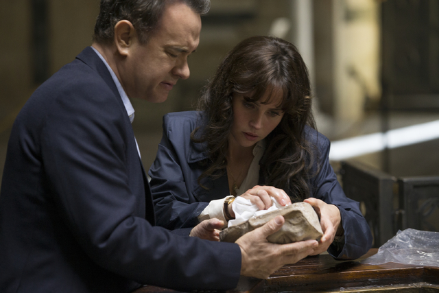 Langdon (Tom Hanks) and Sienna (Felicity Jones) discover Dante's Death Mask in the Baptistry in "Inferno." (Columbia Pictures)