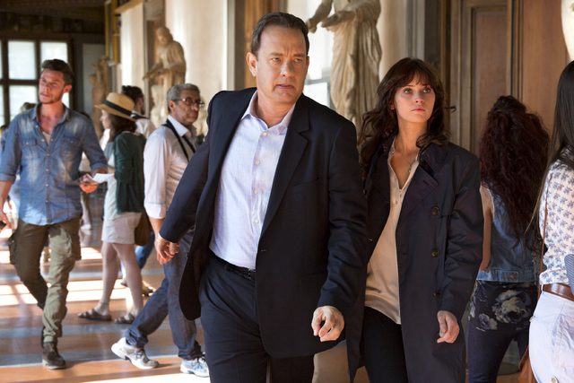Langdon (Tom Hanks) and Sienna (Felicity Jones) exit the Vasari corridor into the Uffizi in "Inferno." (Columbia Pictures)