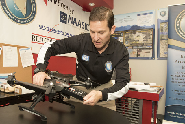 Dr. Chris Walach, director of operations of unmanned aviation for Nevada Institute for Autonomous Systems, discussed the battery life a Yuneec Q500 4K quadcopter following a flight demonstration a ...