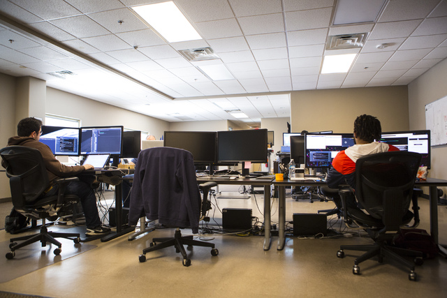 Android Developer Armando Smith, left, and Quality Assurance Engineer Andrew Smith work at their desks at LaunchKey, a Las Vegas-based technology company that was recently acquired by Portland, Or ...