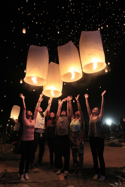 A group releases their paper lanterns at the RiSE Festival Saturday, Oct. 18, 2014 on a dry lake bed near Jean. (Sam Morris/Las Vegas Review-Journal)