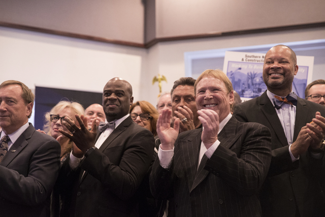 Oakland Raiders owner Mark Davis applauds the signing of Senate Bill 1 at the Richard TAM Alumni Center at UNLV on Monday, Oct. 17, 2016, in Las Vegas. The bill officially allows for a 65,000-seat ...