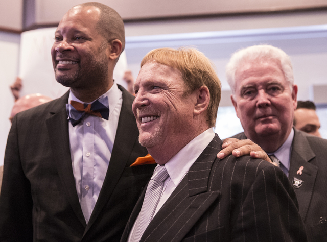 Oakland Raiders owner Mark Davis poses for photos moments after Gov. Brian Sandoval signed Senate Bill 1 at the Richard TAM Alumni Center at UNLV on Monday, Oct. 17, 2016, in Las Vegas. The bill o ...