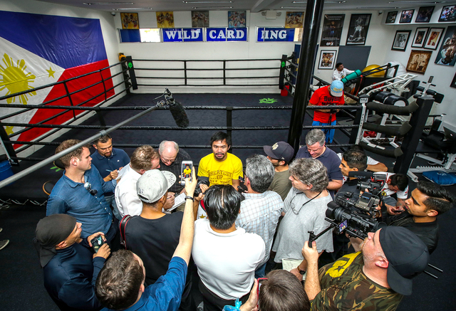 Manny Pacquiao talks to reporters during his Los Angeles media day last week. (Photo by Mikey Williams)