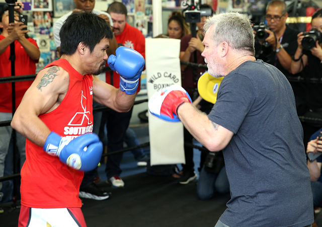 Manny Pacquiao (left) trains with Freddie Roach at a Los Angeles media day last week. (Photo by Mikey Williams)