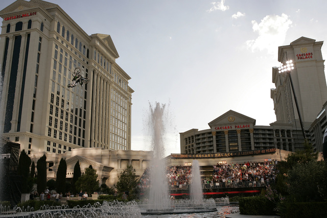Mike Metzger does a backflip over the fountains at Caesars Palace in Las Vegas Thursday, May 4, 2006. The jump was the longest backflip on a motorcycle. John Locher/Las Vegas Review-Journal