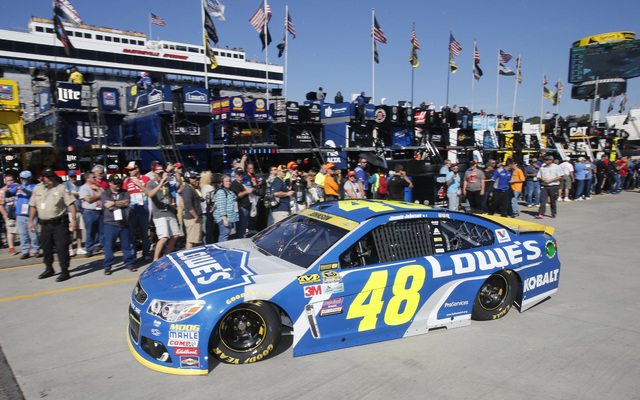 Sprint Cup Series driver Jimmie Johnson (48) leaves the garage during practice for Sunday's Sprint Cup auto race at Martinsville Speedway in Martinsville, Va., Saturday, Oct. 29, 2016. (AP Photo/S ...