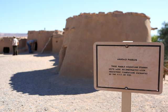 People tour pueblo dwelling replicas outside the Lost City Museum Thursday, Oct. 17 2013, in Overton, Nev. The museum, located at 721 S. Moapa Valley Blvd., contains artifacts found in Southern Ne ...