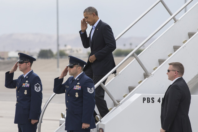 U.S. President Barack Obama steps off Air Force One on Sunday, Oct. 23, 2016, at McCarran International Airport, in Las Vegas. President Obama was in Las Vegas campaigning for Democratic president ...