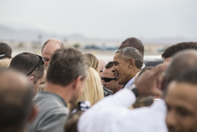 U.S. President Barack Obama greets supporters on Sunday, Oct. 23, 2016, at McCarran International Airport, in Las Vegas. President Obama was in Las Vegas campaigning for Democratic presidential no ...