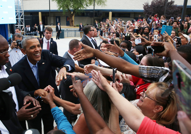 President Barack Obama shakes hands with supporters at a rally organized by the Nevada State Democratic Party at Cheyenne High School on Sunday, Oct. 23, 2016, in North Las Vegas. President Obama  ...