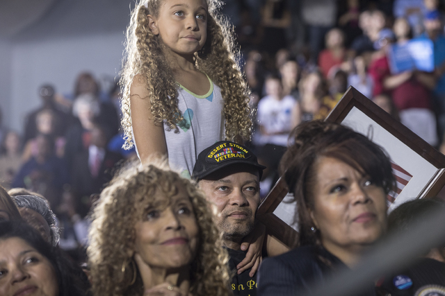 Supporters of President Barack Obama listen to the President speak during a rally organized by the Nevada State Democratic Party at Cheyenne High School on Sunday, Oct. 23, 2016, in North Las Vega ...