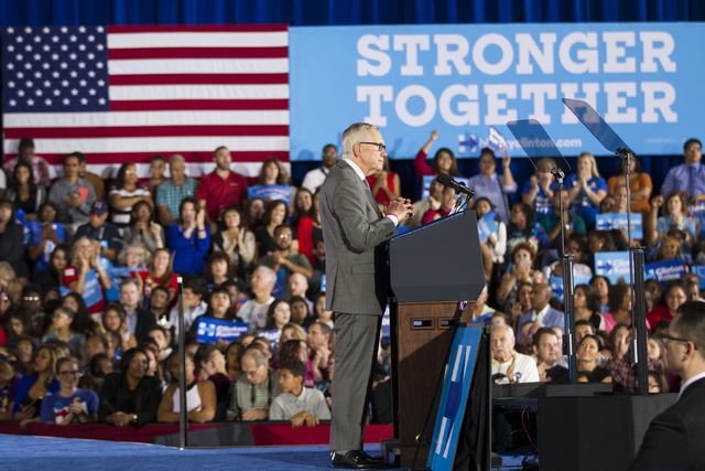 U.S. Sen. Harry Reid, D-Nev., pauses during speech in a campaign rally for Democratic presidential nominee Hillary Clinton at Cheyenne High School on Sunday, Oct. 23, 2016, in North Las Vegas. Eri ...