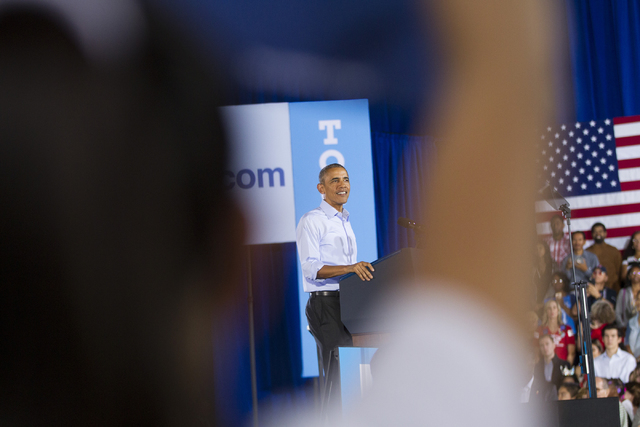 President Barack Obama pauses in his speech during a campaign rally for Democratic presidential nominee Hillary Clinton at Cheyenne High School on Sunday, Oct. 23, 2016, in North Las Vegas. Erik V ...