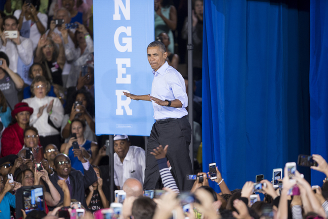 President Barack Obama takes the stage for a campaign rally speech for Democratic presidential nominee Hillary Clinton at Cheyenne High School on Sunday, Oct. 23, 2016, in North Las Vegas. Erik Ve ...