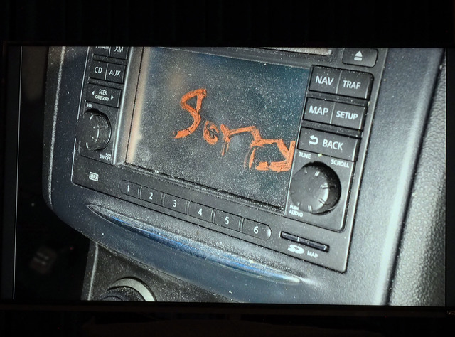 A photo showing the word 'Sorry' scribbled on the dash of a vehicle driven by Rex Vance Wilson is displayed as as Metro Undersheriff Kevin McMahill speaks during a news conference at Metropolitan  ...