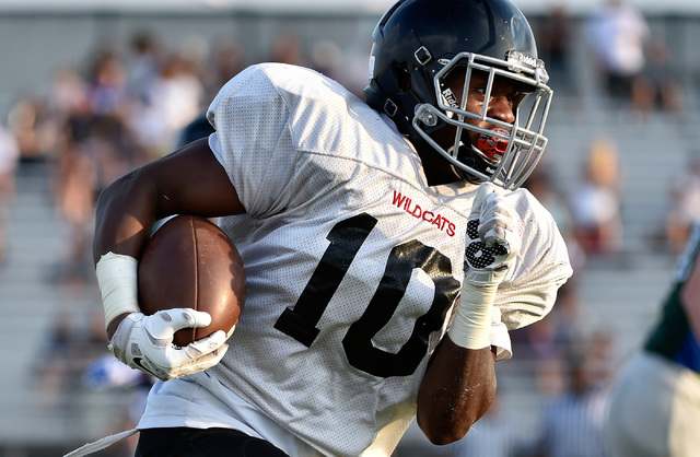 Las Vegas High's Elijah Hicks runs with the ball during a scrimmage against Green Valley at Green Valley High School Friday, Aug. 19, 2016, in Henderson. (David Becker/Las Vegas Review-Journal) Fo ...